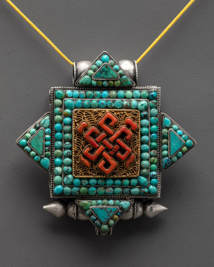 Close up of silver Endless Knot Locket showing intricate gold-plated filigree and stone details