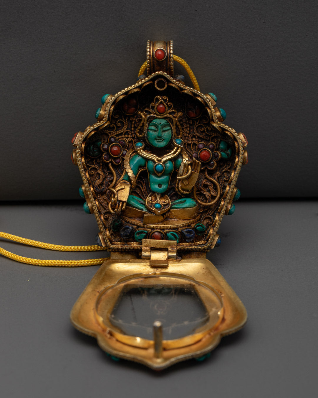 Hand-Carved Green Tara Locket with Vajrayana Buddhist Symbolism