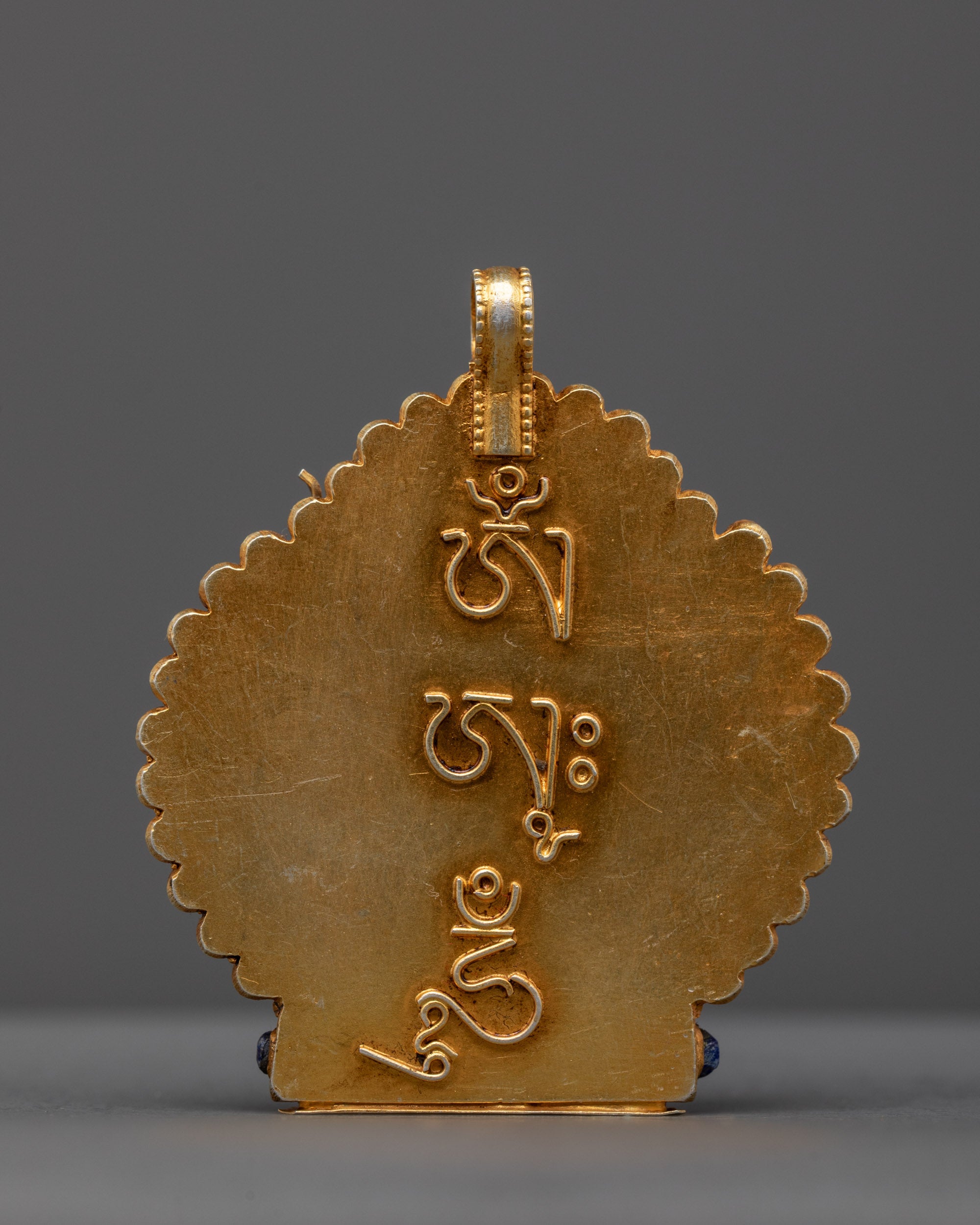 back view of gold-gilded Guru Rinpoche locket handcrafted by Nepalese artisans
