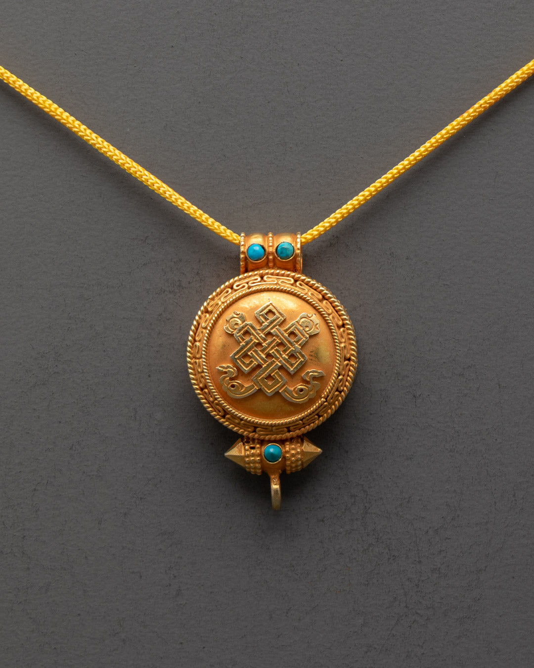 Front view of Gold Plated Endless Knot Buddhist Locket