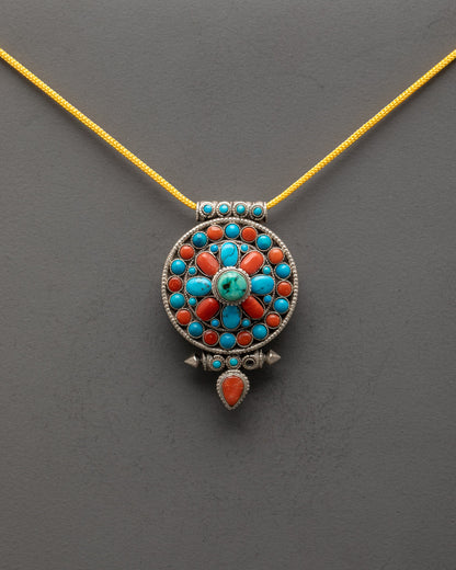 Front view of Tibetan Buddhist Pendant with shining silver body and semi-precious stones

