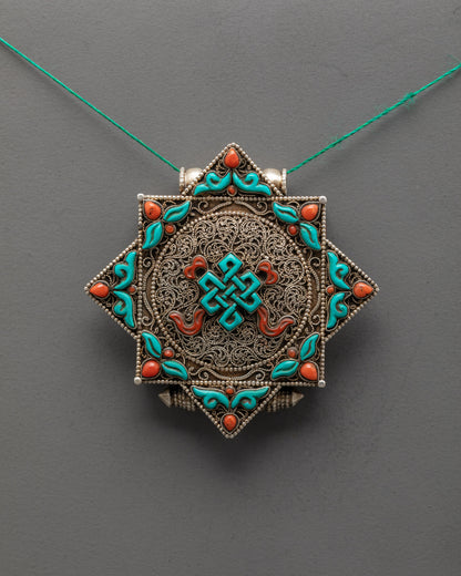 Front view of Elegant Endless Knot Locket with silver body and turquoise coral stones