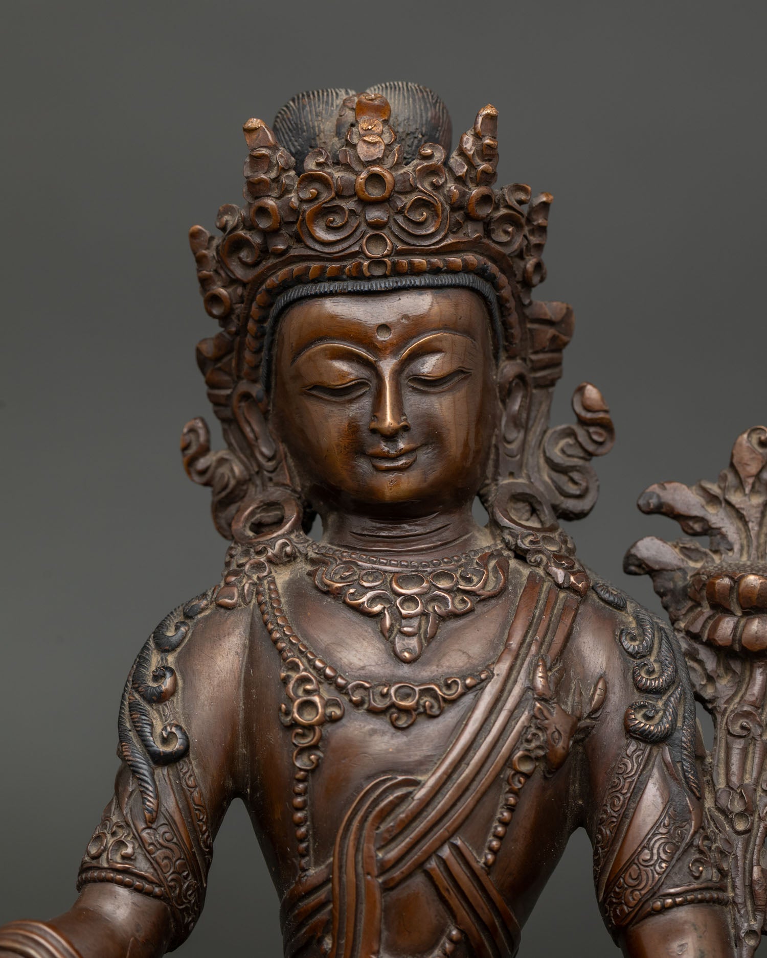 Lokeshwor statue detailed face with ornate crown and traditional jewelry.