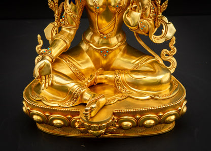 Lower-angle front view of Green Tara statue in Lalitasana posture with gold-gilded copper details, handcrafted Nepalese art
