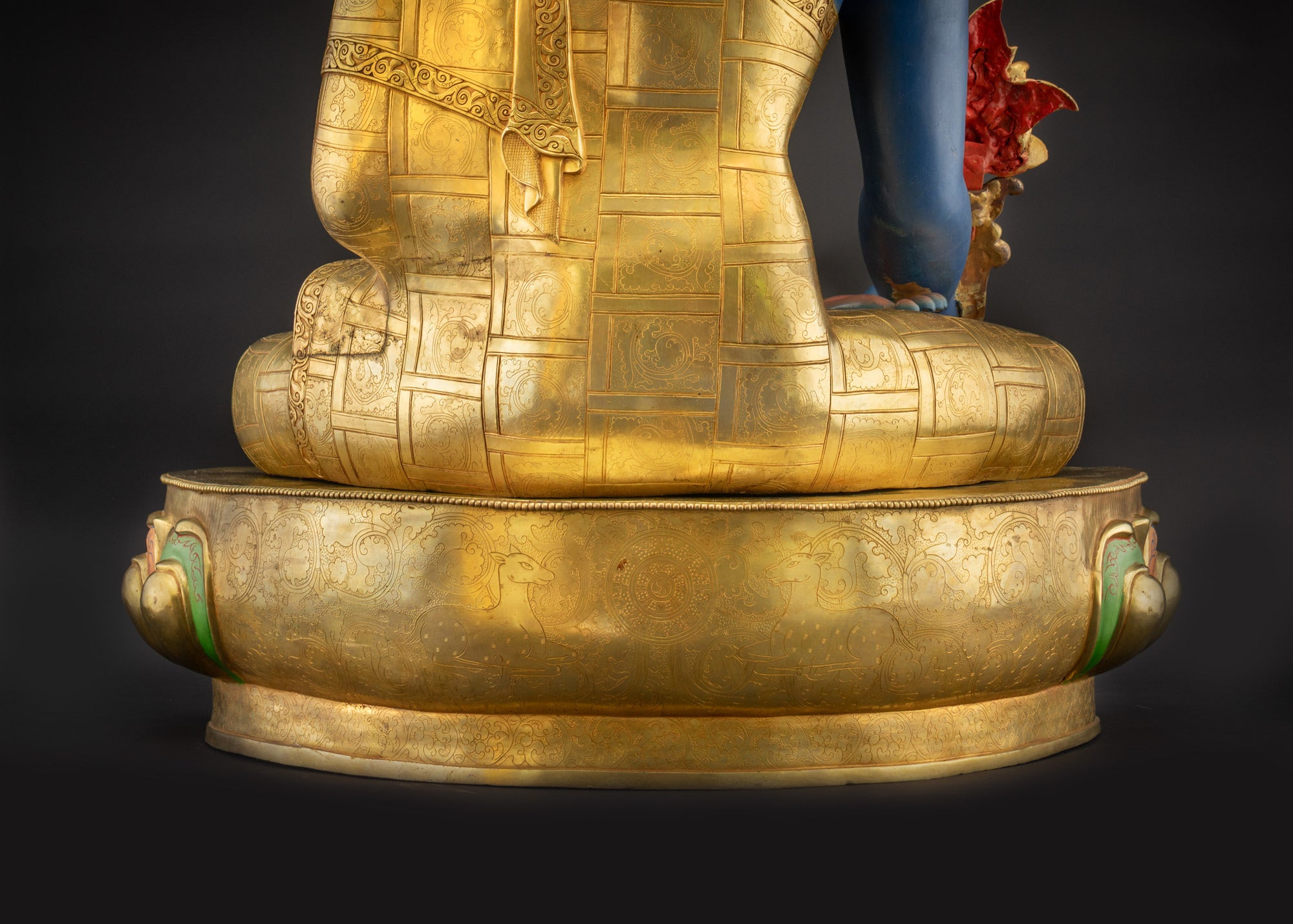 Lower landscape back view of 44" Nepalese Medicine Buddha Statue highlighting carved robes