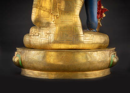 Lower landscape back view of 44" Nepalese Medicine Buddha Statue highlighting carved robes