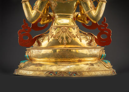 Lower landscape back view of Chenrezig Statue highlighting dharma wheel and deers carving