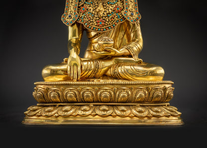 Lower landscape front view of handcrafted Jowo Rinpoche Buddha on lotus
