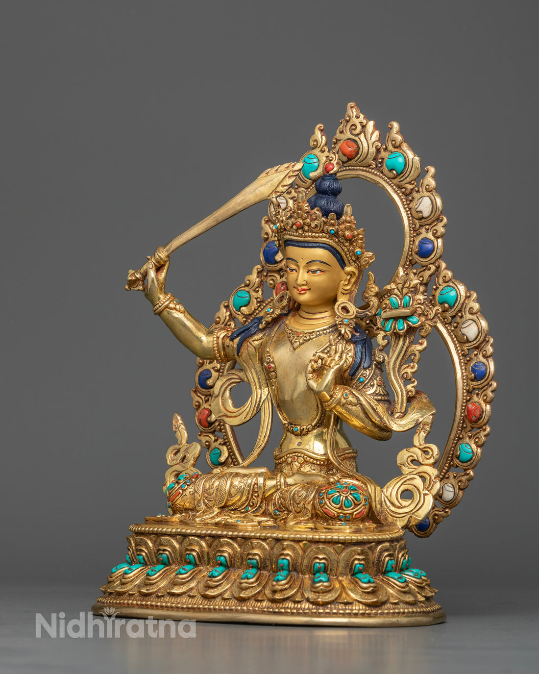 Manjushri Seated on a Lotus Throne with Gemstone Halo