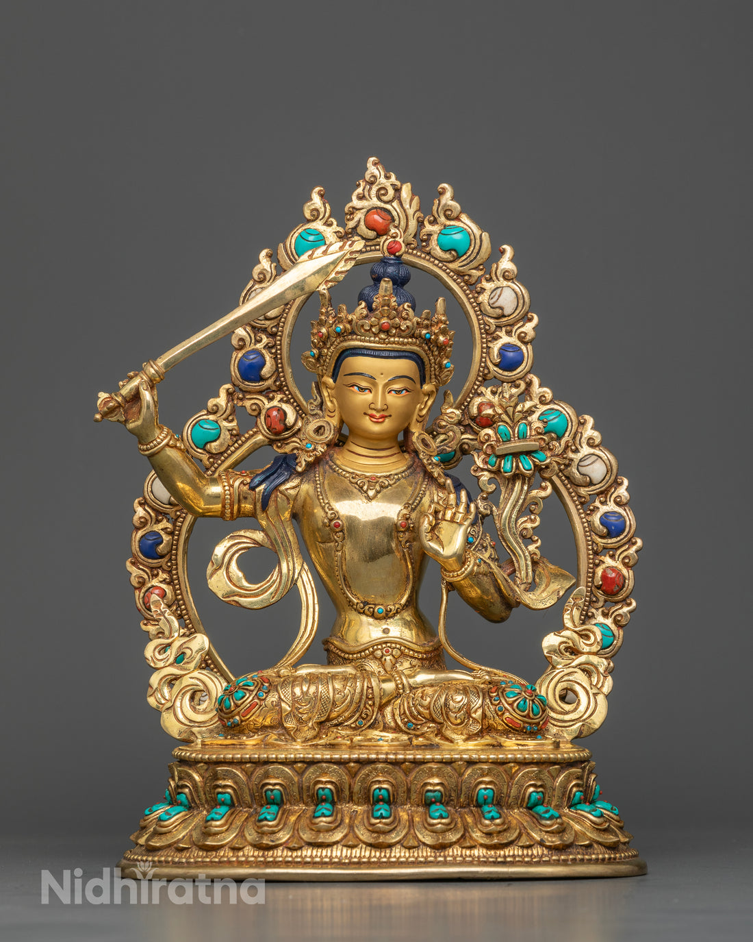 Manjushri Seated on a Lotus Throne with Gemstone Halo