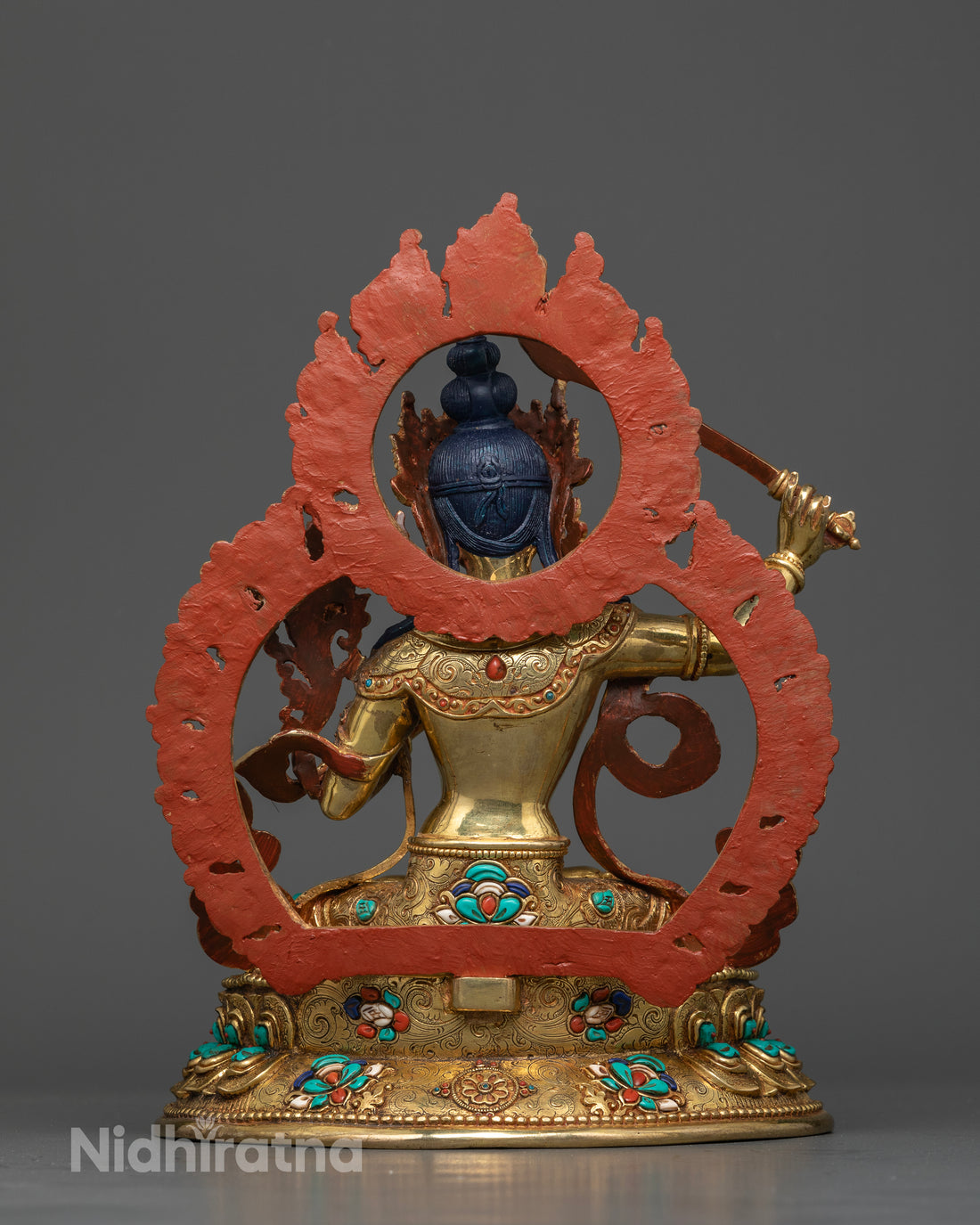 Manjushri Seated on a Lotus Throne with Gemstone Halo