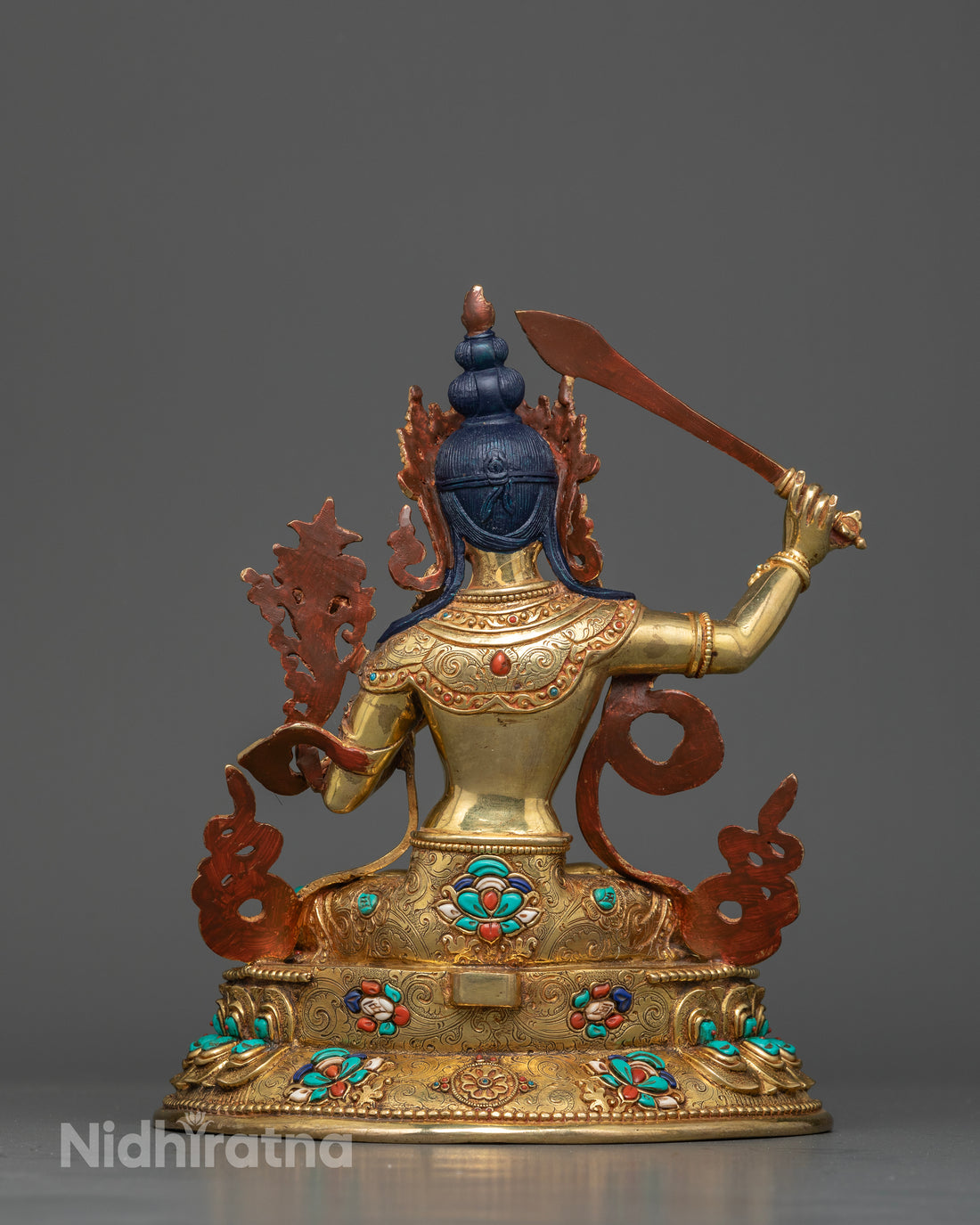 Manjushri Seated on a Lotus Throne with Gemstone Halo