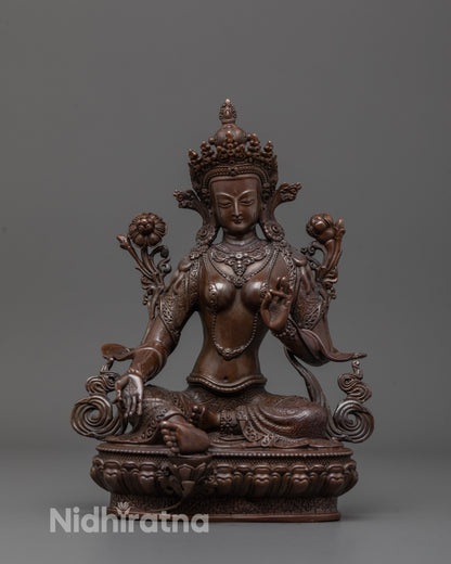 Machine-made Green Tara Statue seated on lotus base with peaceful expression