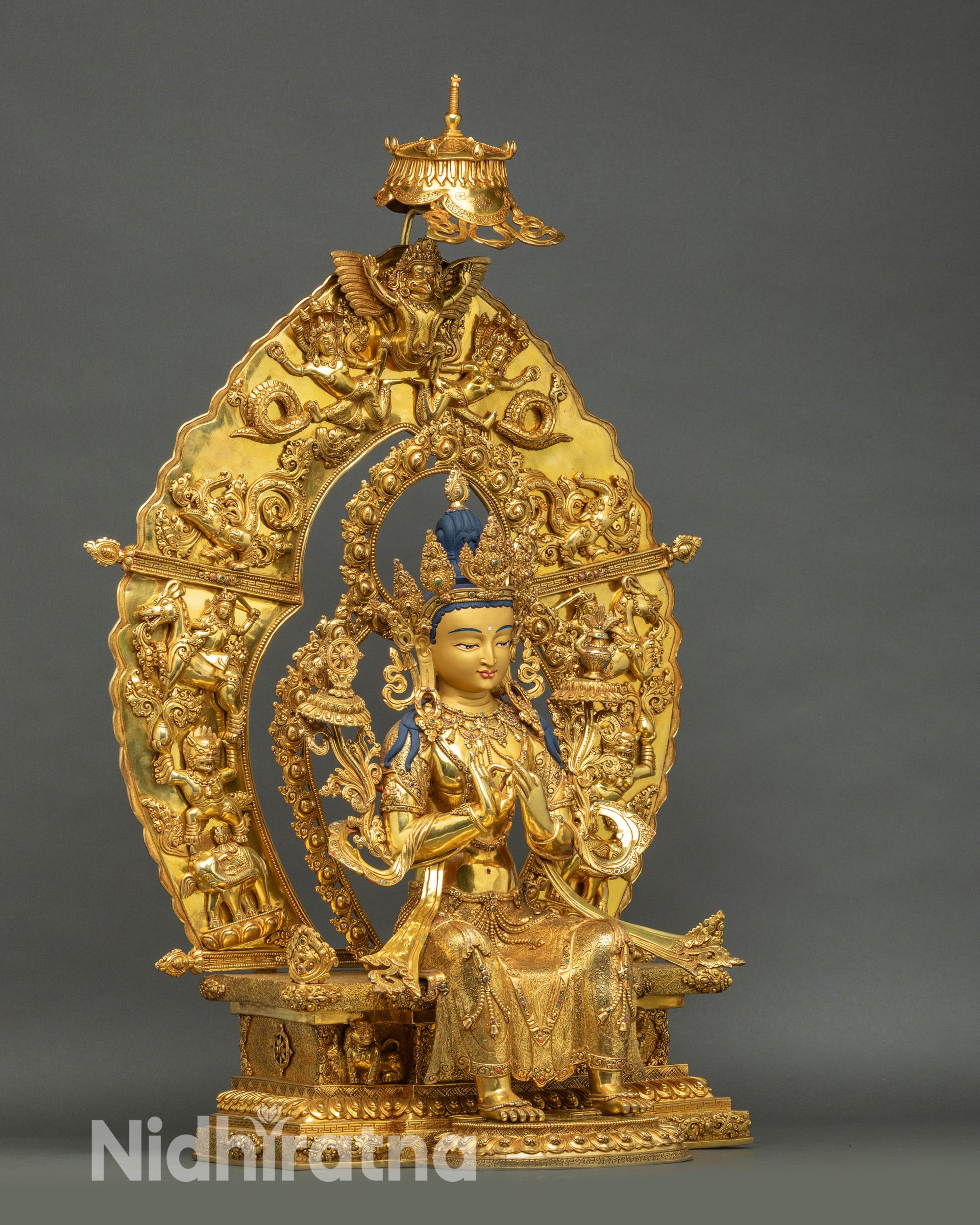 Maitreya Buddha Statue side close-up with carved ceremonial robe and semi-precious stone inlays