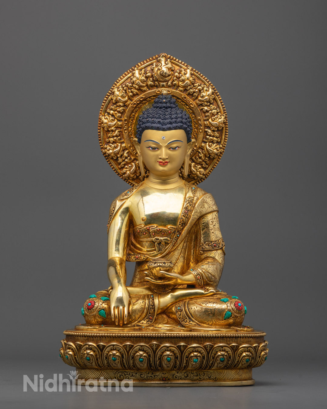 Majestic Gautama Buddha statue front view with 24K gold face and intricate carvings detail
