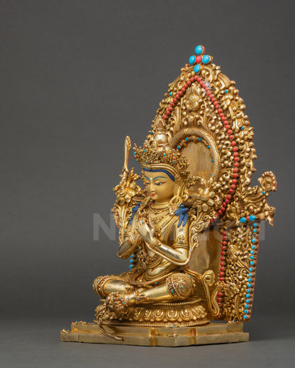Left side of Manjushree Altar Sculpture holding utpala stem with blooming flower beside shoulder