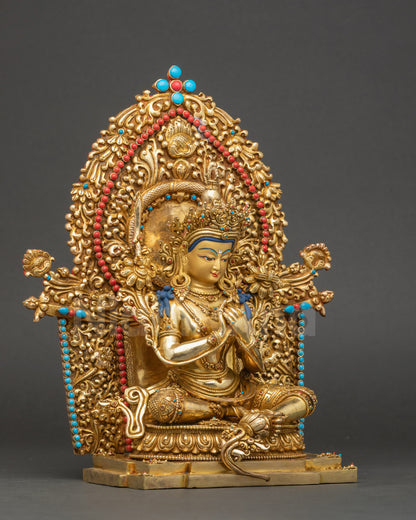 Right side of Manjushree Sculpture showing dharmachakra mudra, flowing robe, and semi-precious stones