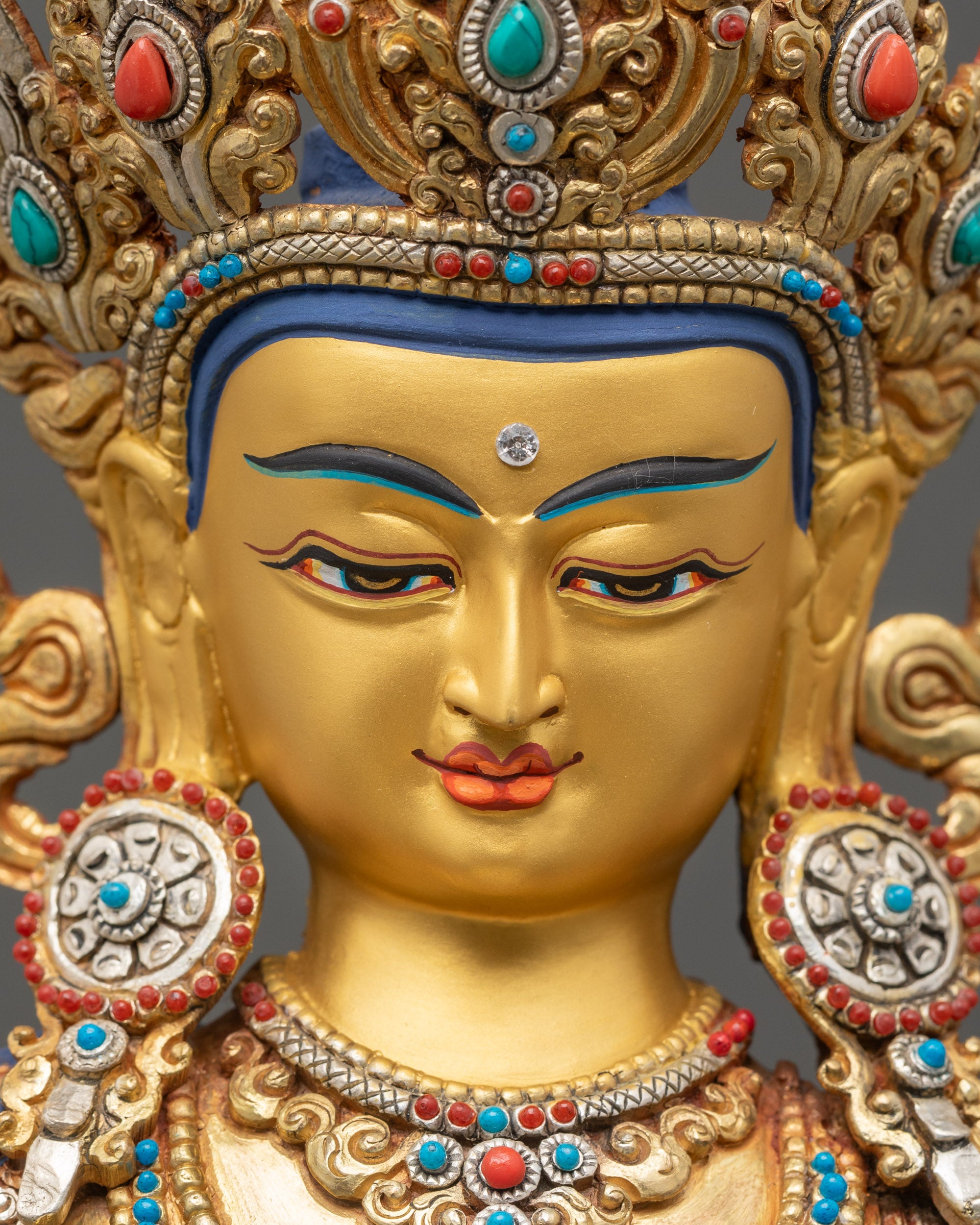 Manjushree Meditation Statue serene gold-gilded face close up