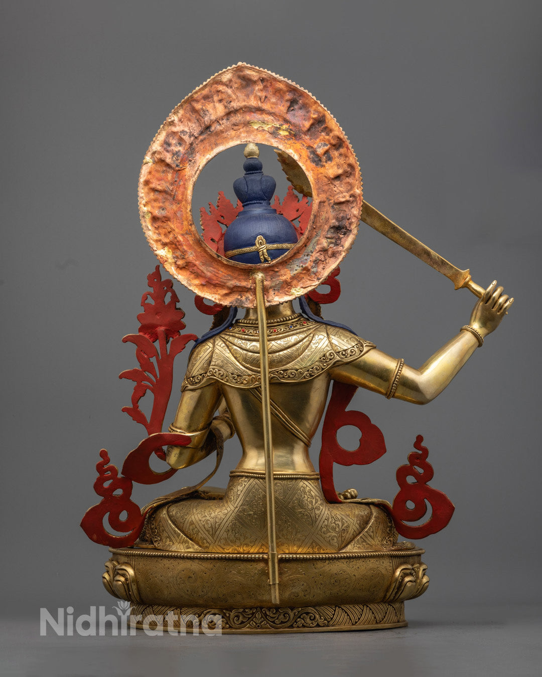  Manjushree statue with ornate halo, lotus throne, and intricate robe detailing, representing the embodiment of transcendent wisdom.