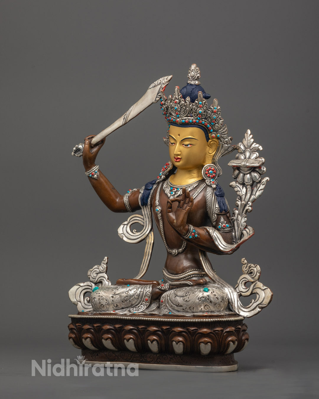 right angle of Manjushri holding Prajna Paramita scripture with gemstone accents