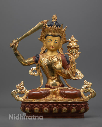 Hand-carved Manjushri Statue in oxidized copper with 24K gold gilding and vibrant acrylic colors