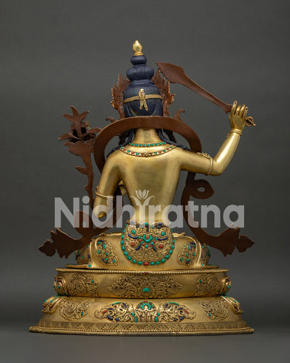 Manjushri statue back view, sacred mantra-engraved lotus pedestal, 24K gold fire-gilded copper Nepal