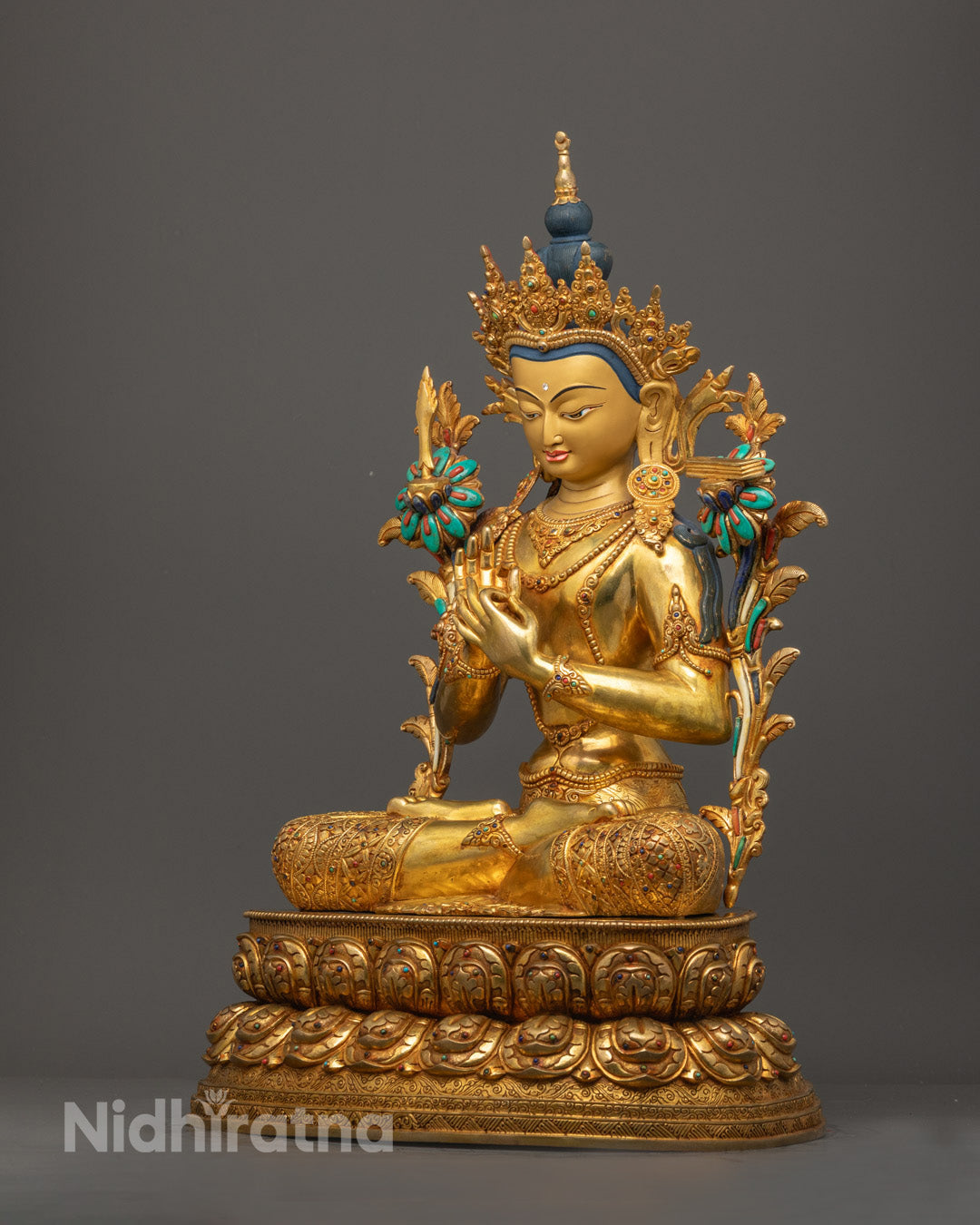Manjushri Bodhisattva seated on lotus throne with five-jeweled crown and detailed Buddhist jewelry craftsmanship
