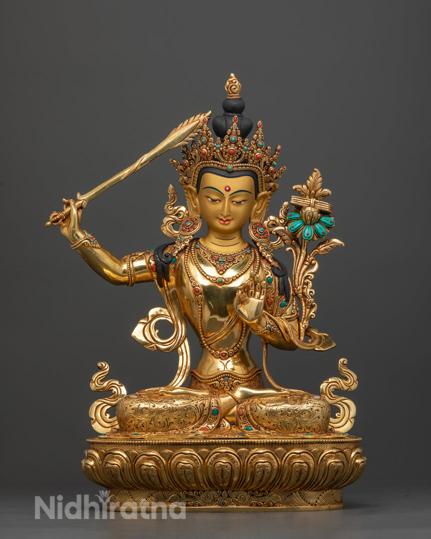 Manjushri Buddha statue, masterfully hand-crafted in Patan, Nepal, featuring a 24k pure gold-painted face, vibrant gold-glided copper body, and adorned with turquoise and other semi-precious stones, symbolizing wisdom, knowledge, and spiritual enlightenment.