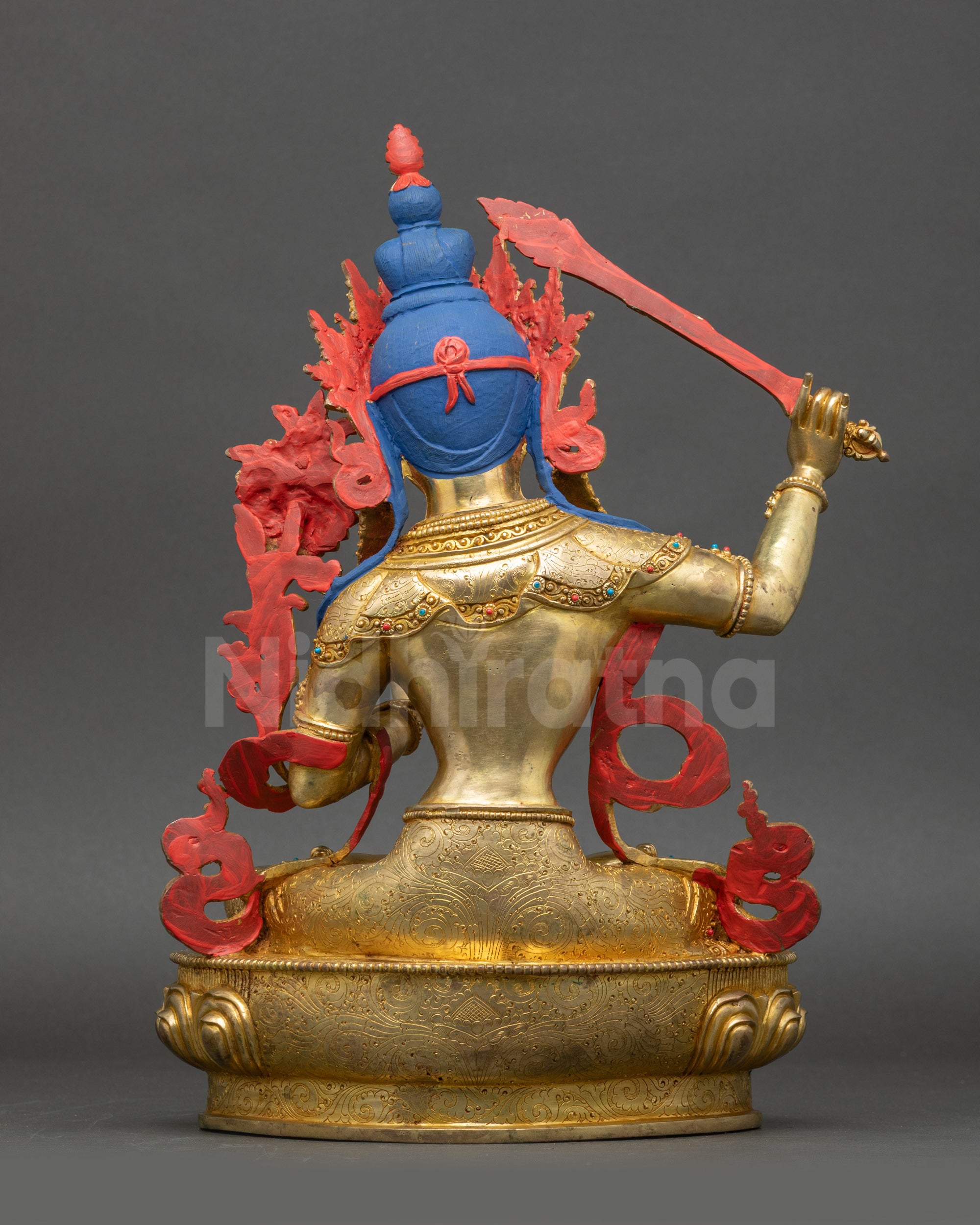Manjushri Statue back view showing intricate robe folds and lotus throne design