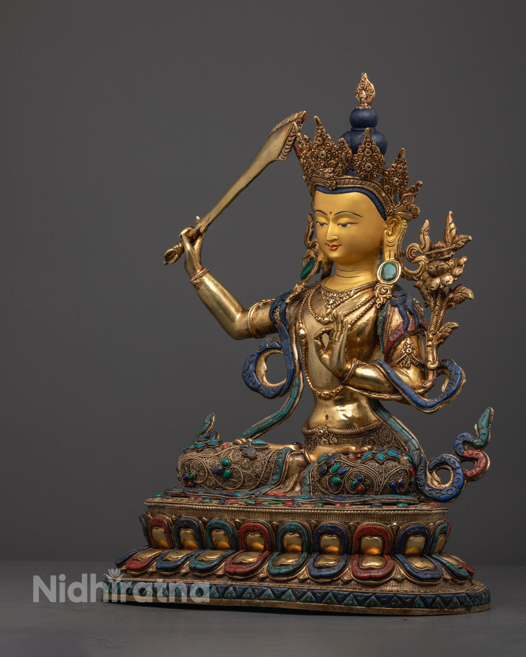 Manjushri Statue holding double-edged sword with vajra handle and wisdom flame – handcrafted for devotees seeking clarity and spiritual growth