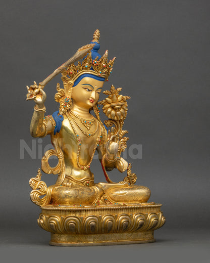 Manjushri Statue right side view copper alloy with gold-gilded robe and lotus patterns