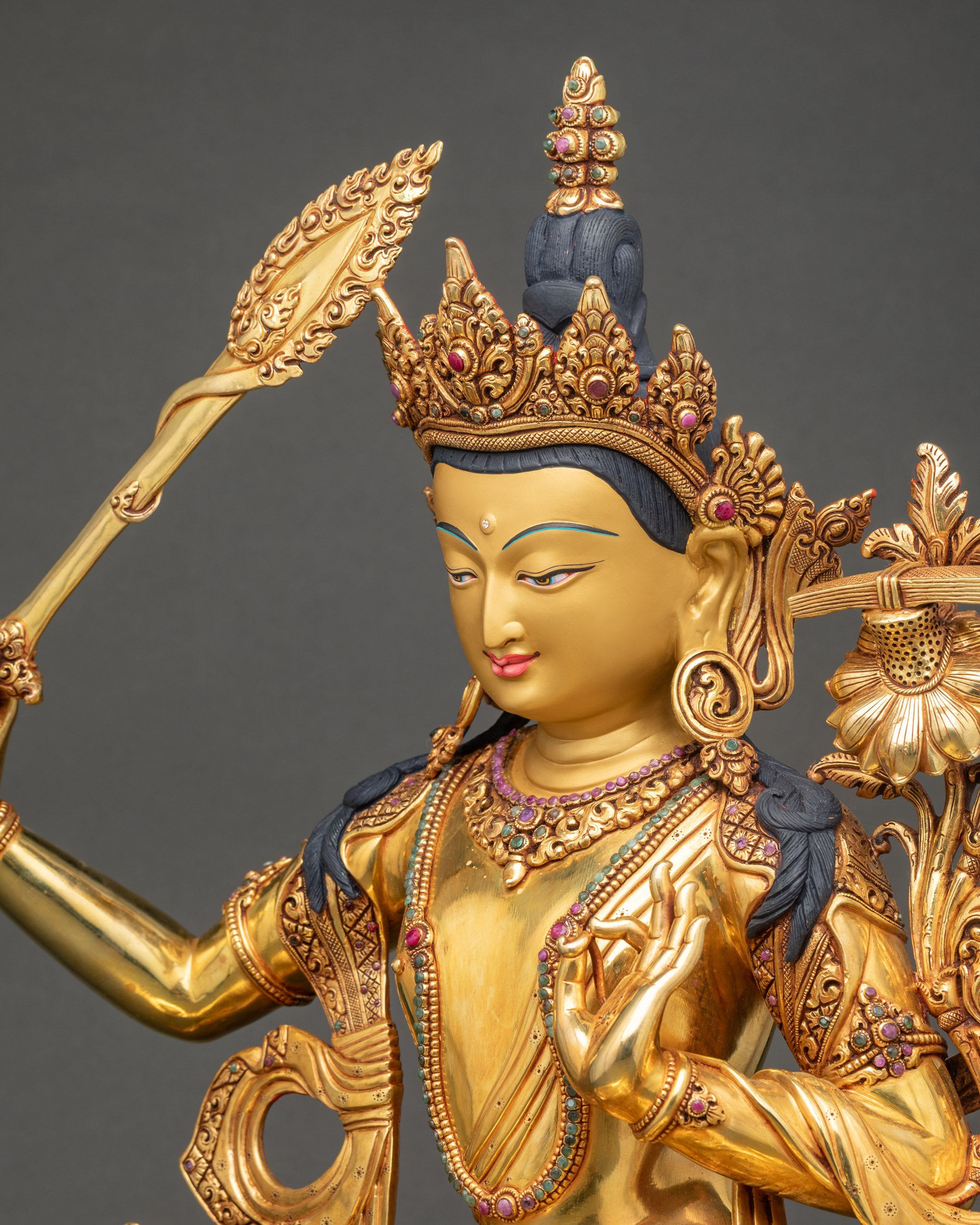 Manjushri Statue side view lotus seat with dharma wheel and deer carvings