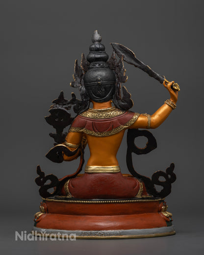 Manjushri statue, focusing on the flowing details of the robe and the vibrant acrylic work, symbolizing the Bodhisattva’s divine presence and spiritual energy."

