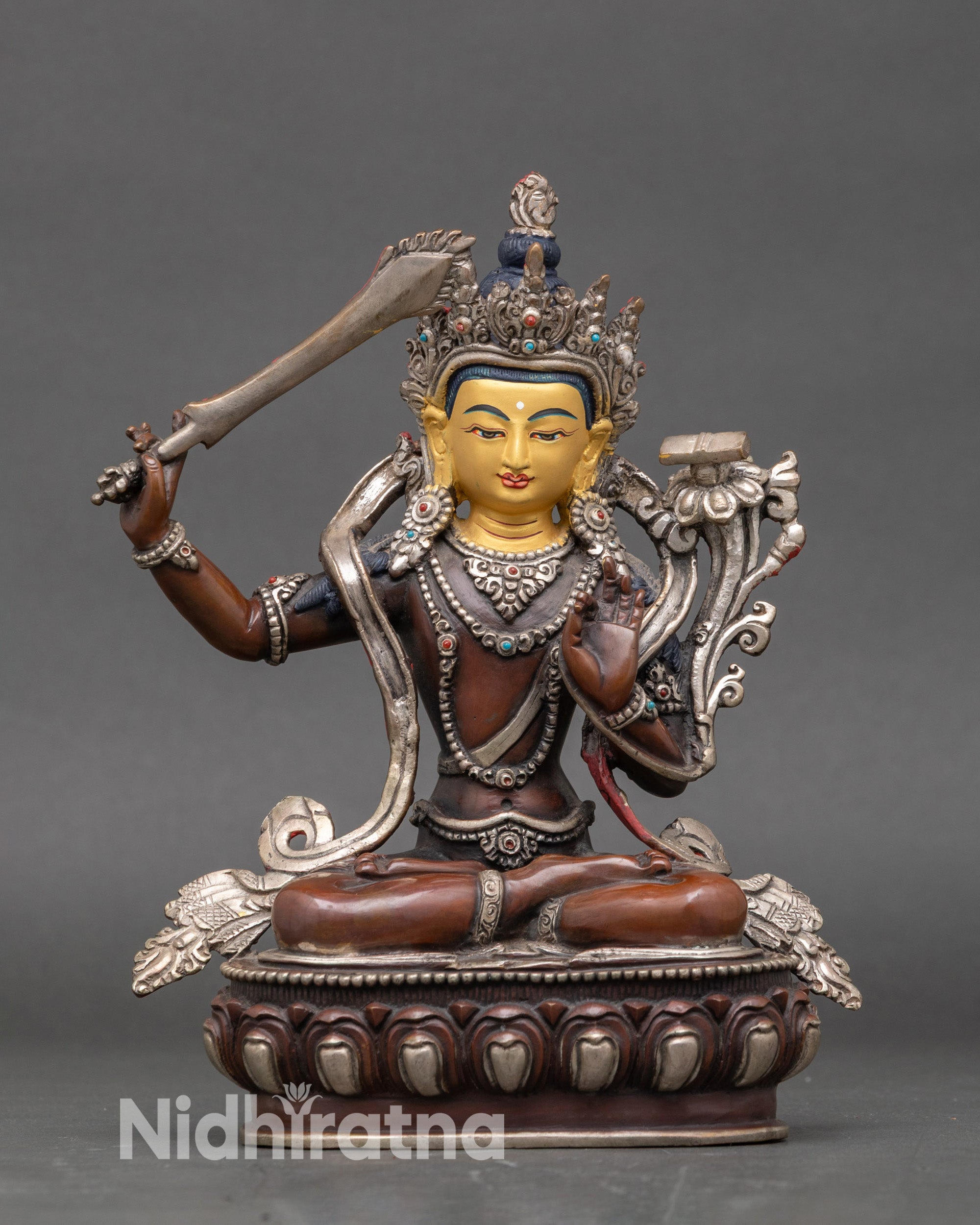 Manjushri statue on lotus throne, handcrafted Nepalese copper with gold-painted face