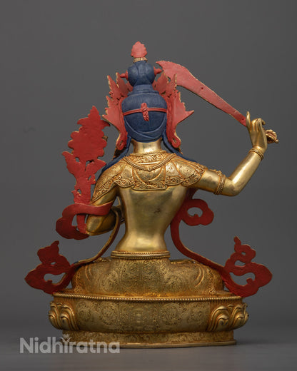 Manjushri statue with flowing robes and intricate jewelry, exquisite craftsmanship of the 35.5cm Manjushri statue, featuring a gold-gilded face, flowing robes, and jewelry, embodying enlightenment and wisdom