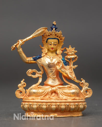 Manjushri statue with gold fire-gilded body and 24K gold-painted face from Nepal