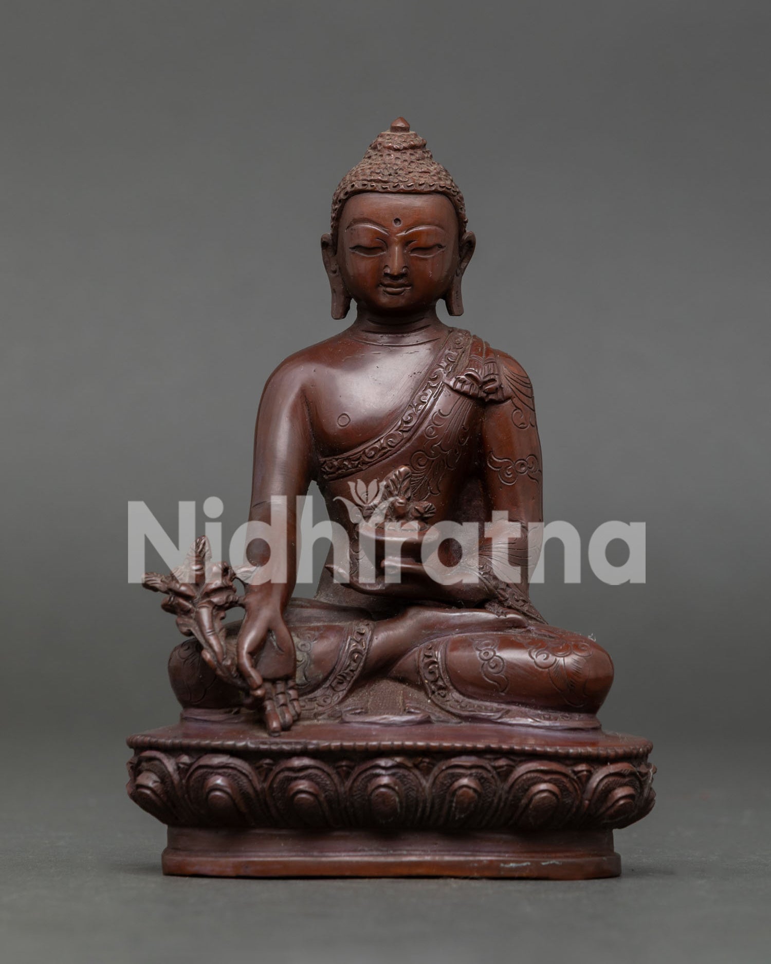 Medicine Buddha statue copper oxidized finish, handmade in Nepal by skilled Newari artisans, seated on lotus pedestal with healing symbolism.