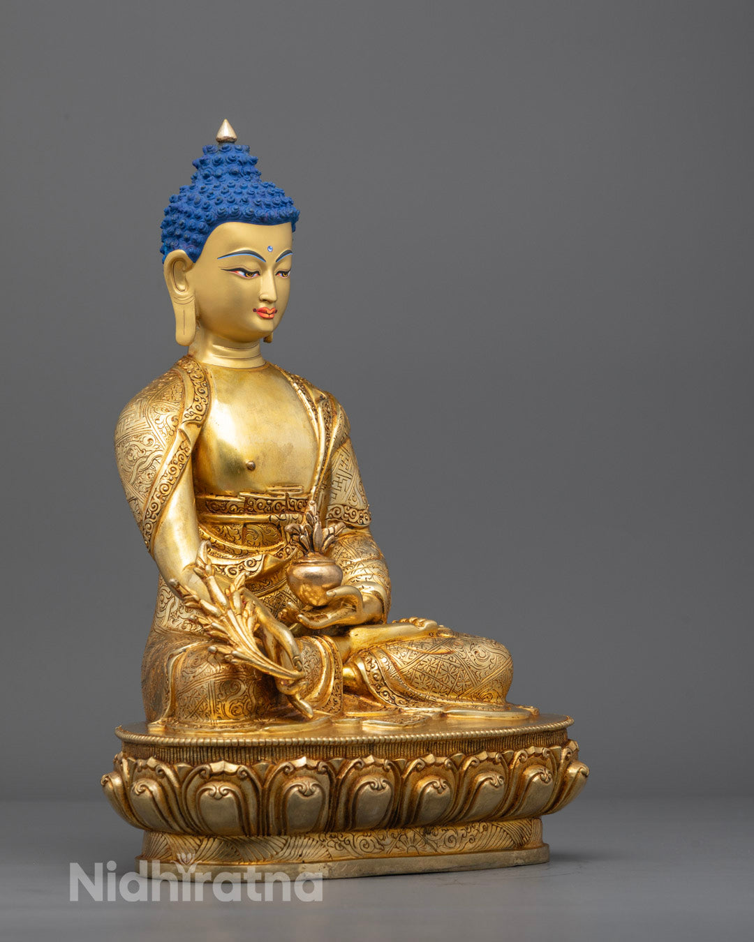 Side view of traditional Nepali-crafted Medicine Buddha statue, showcasing intricate details