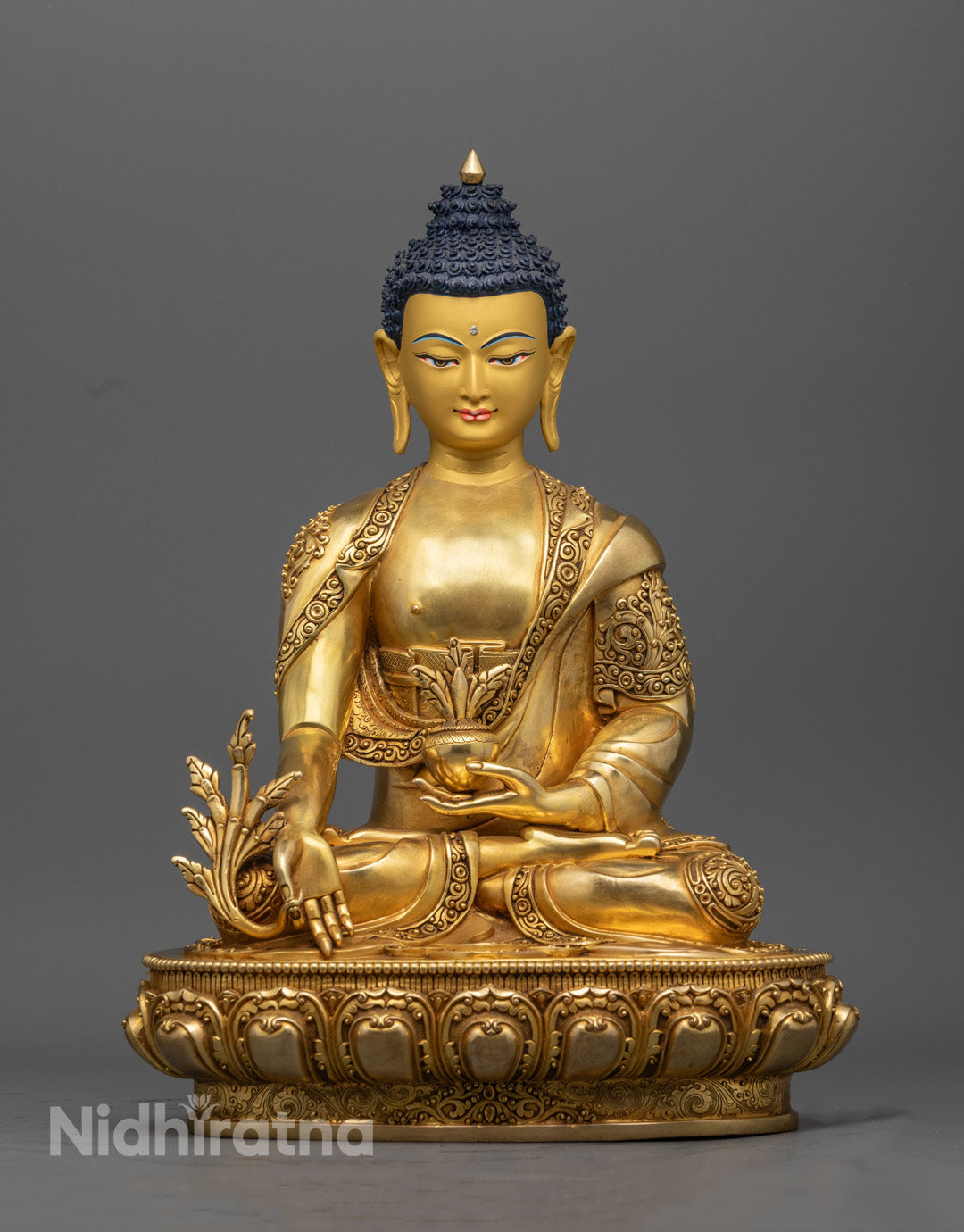 Hand-carved Medicine Buddha statue with 24K gold-gilded face, symbolizing healing and protection, crafted using the lost wax method in Nepal