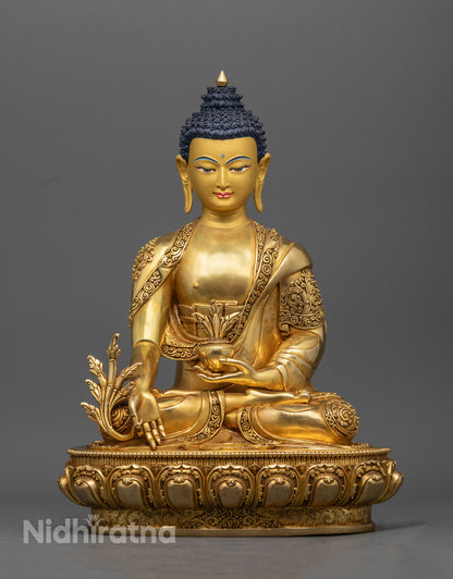 Hand-carved Medicine Buddha statue with 24K gold-gilded face, symbolizing healing and protection, crafted using the lost wax method in Nepal
