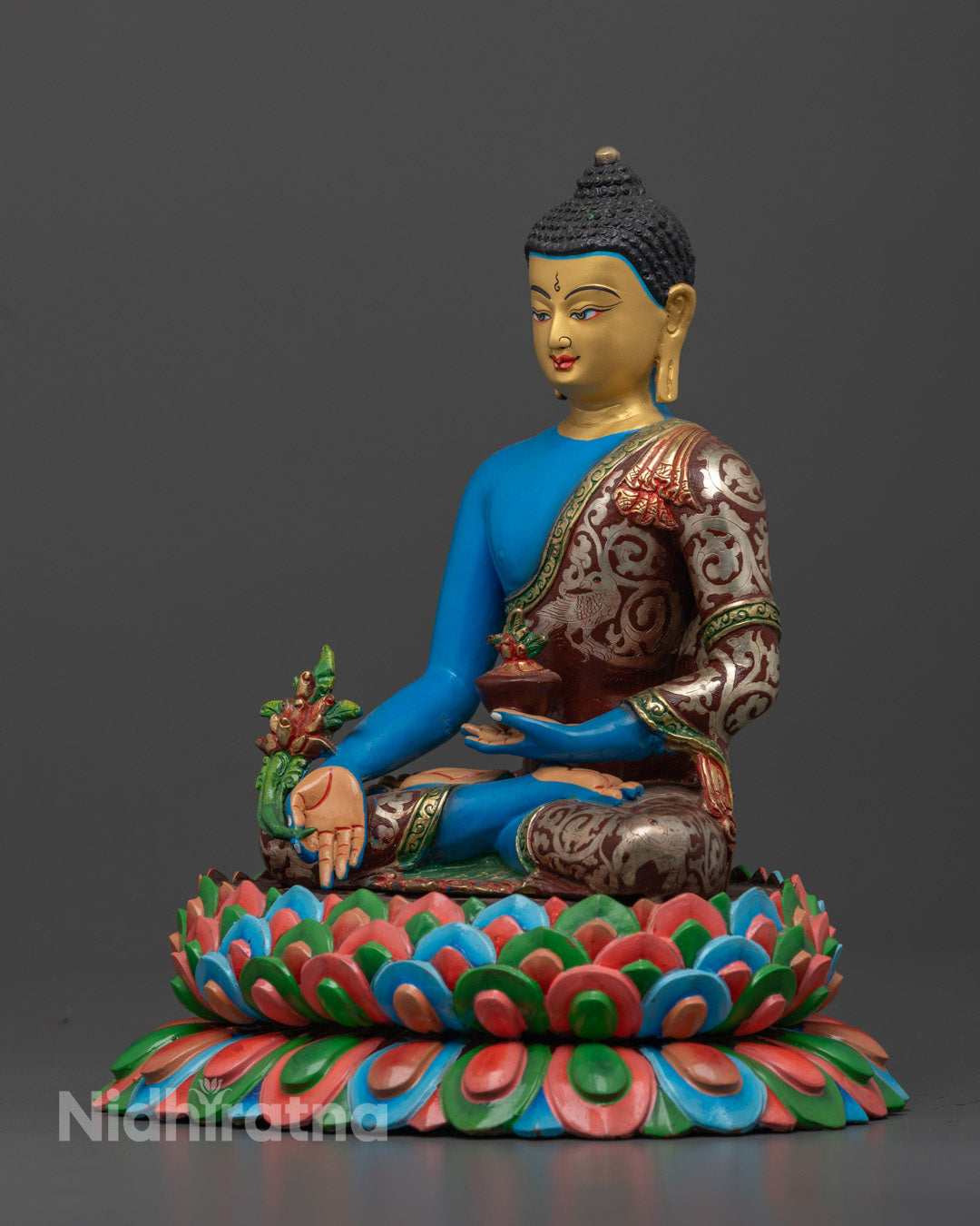 Medicine Buddha holding the Medi-Bowl, representing healing of physical and spiritual ailments in Buddhist tradition