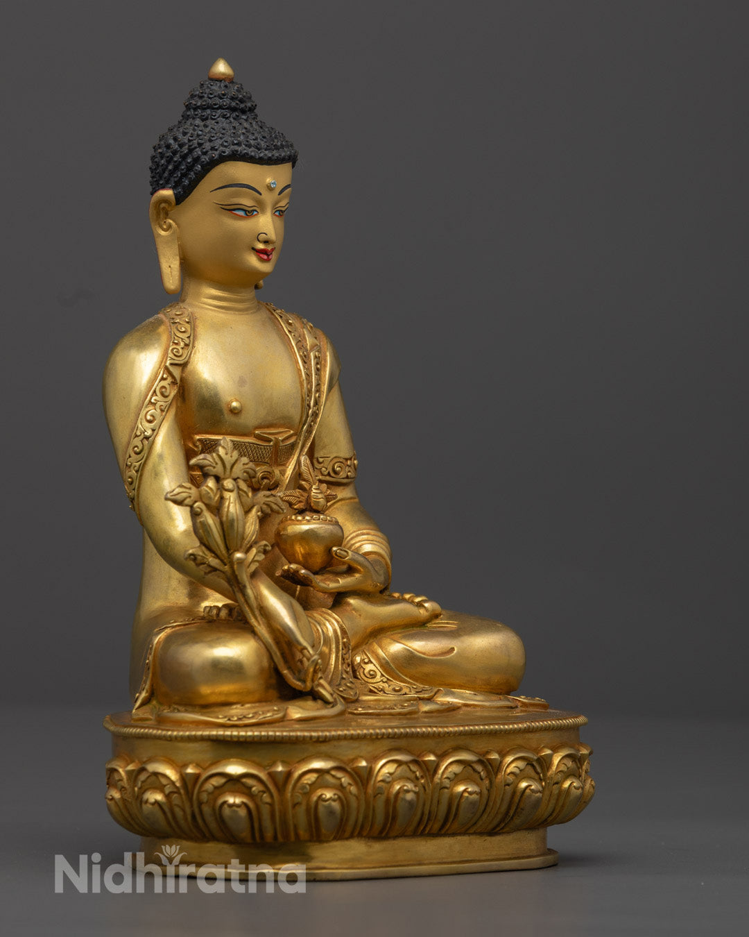 Medicine Buddha's serene expression, featuring fine 24K gold gilding and traditional Tibetan craftsmanship, symbolizing peace and enlightenment.