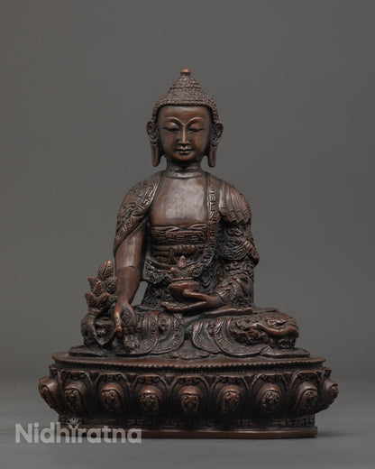 Medicine Buddha statue seated on lotus throne, crafted from oxidized copper with vibrant acrylic colors.