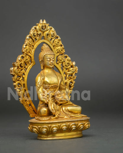 Medicine Buddha statue detailed view of healing bowl and handcrafted robes.