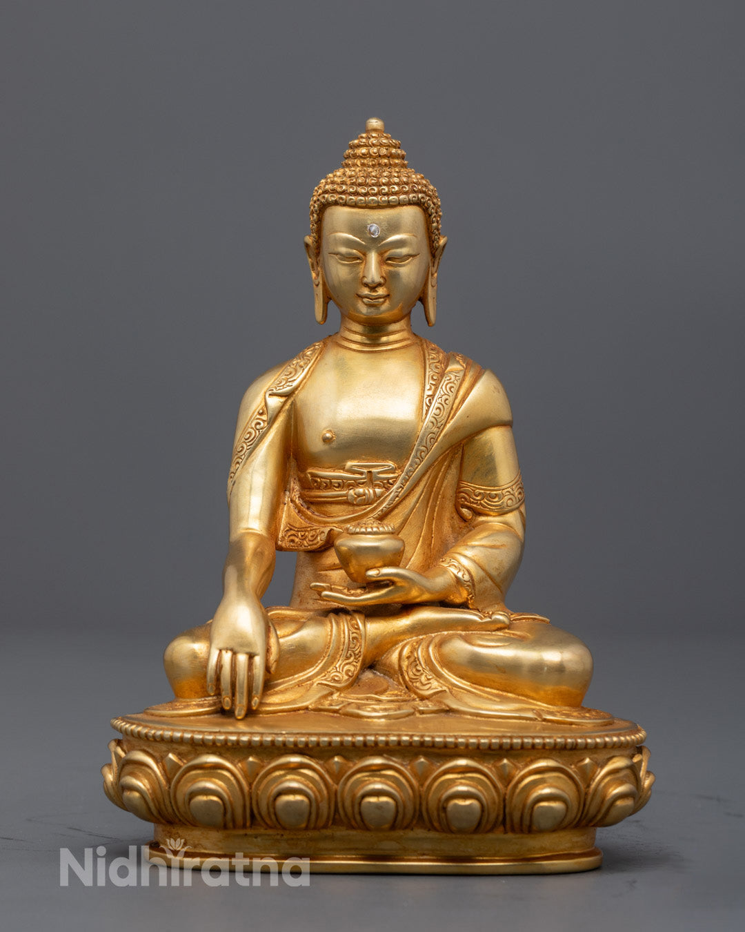 Meditating Buddha Shakyamuni sculpture handcrafted by Nepalese artisan using lost wax method with gold-gilded face and 24K fire-gilded body