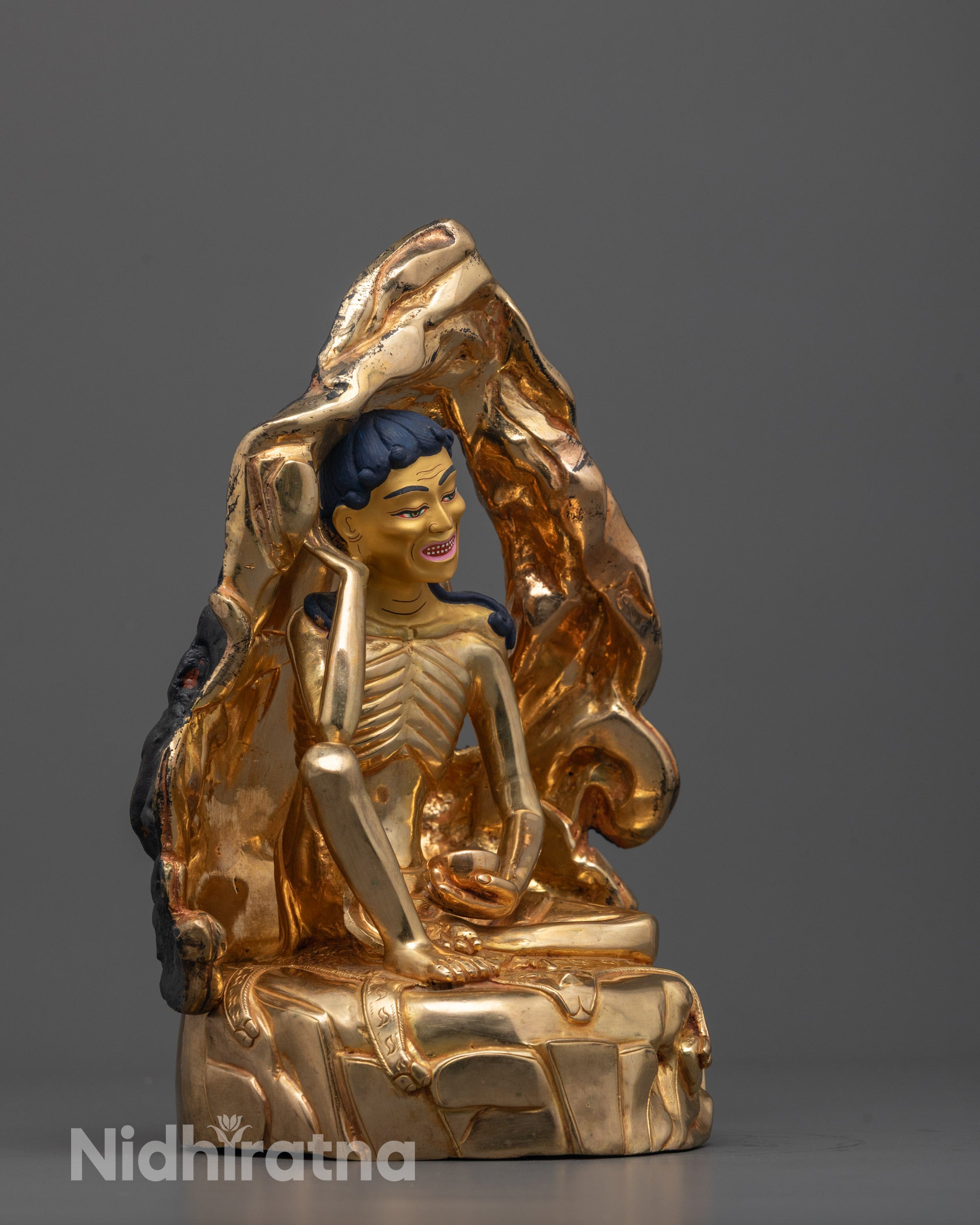 side angle of handcrafted milarepa statue with gold fire-gilded body