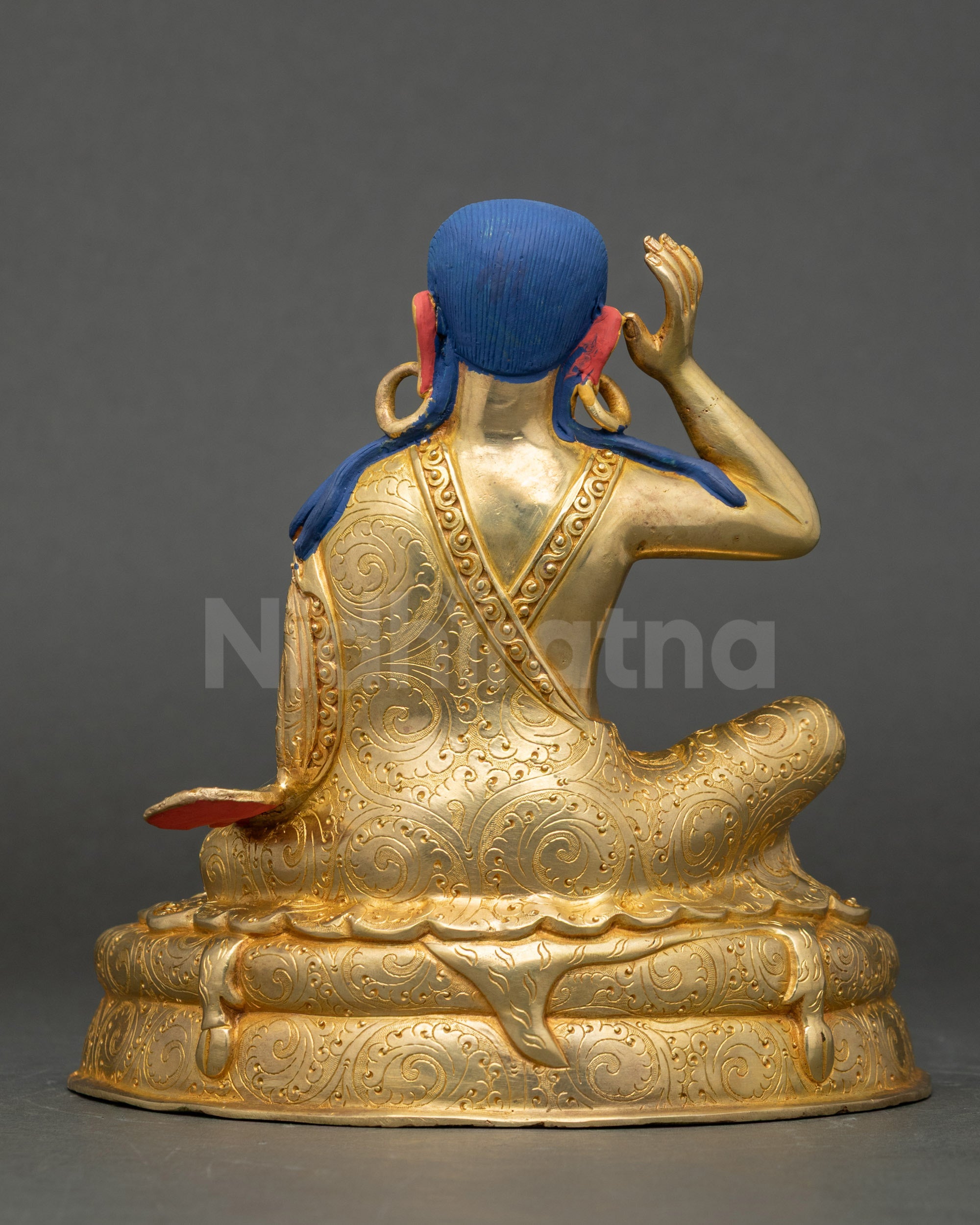 Milarepa back view showing intricate carvings and artisan-crafted robes and seat