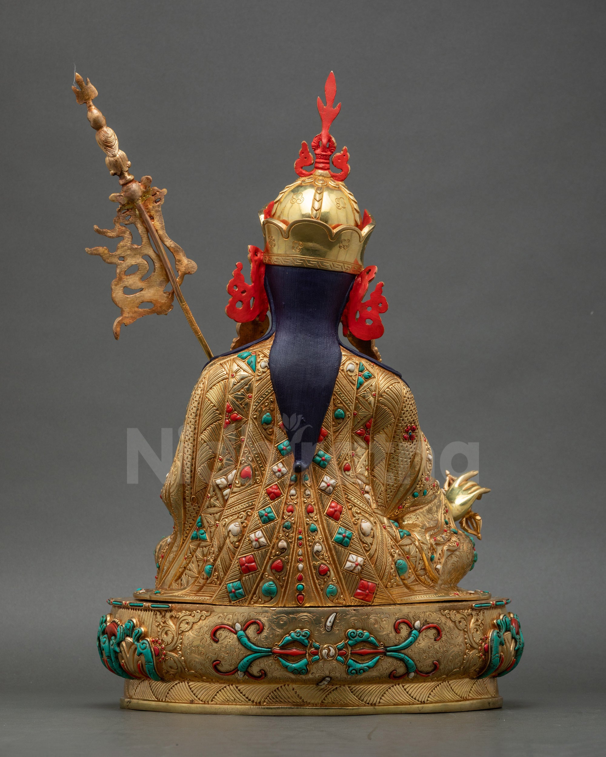 Intricately carved kasaya robe on Guru Padmasambhava statue fire-gilded Nepalese copper