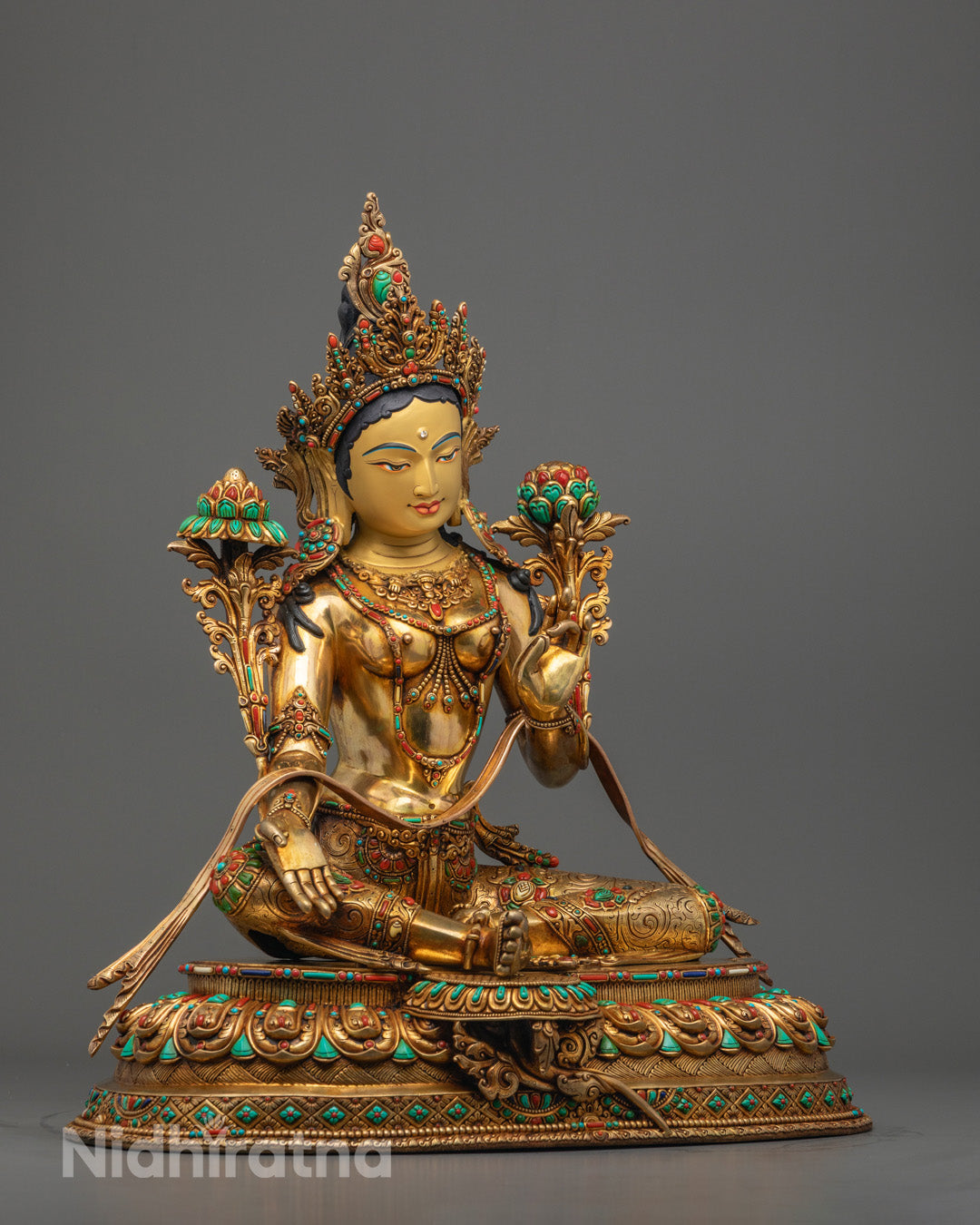 Mother Green Tara statue seated on lotus throne in royal ease posture holding Varada Mudra, symbolizing blessings and compassion