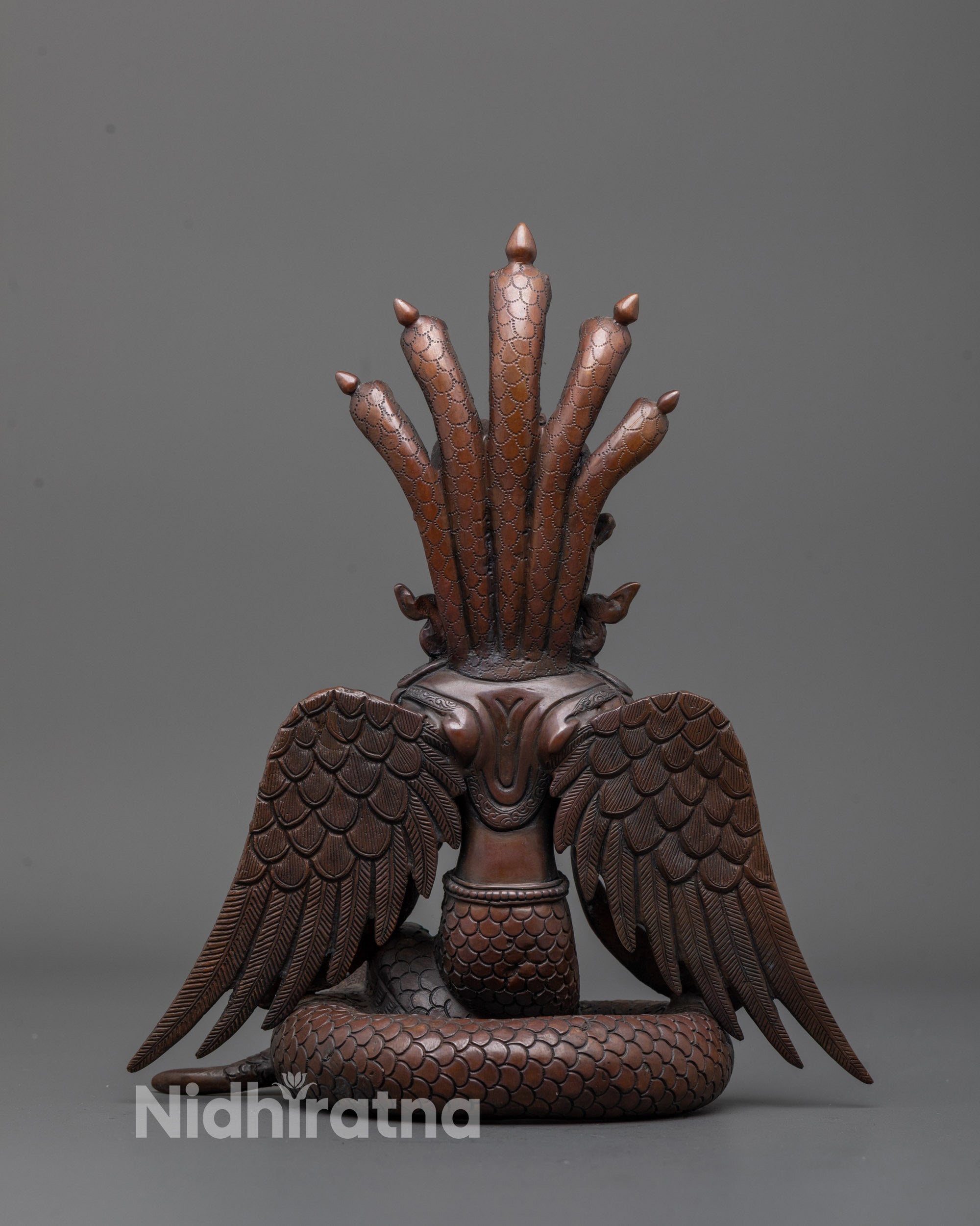Back view of Oxidized Nagakanya sculpture revealing detailed cobra headdress and finish